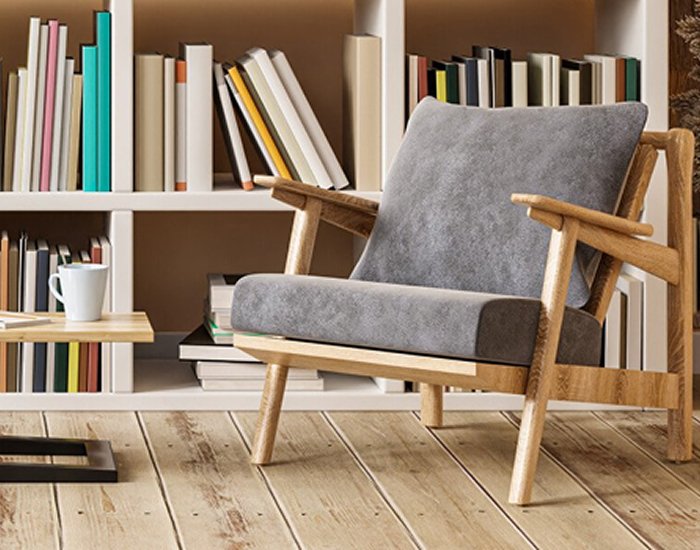 Poltrona numa sala com estante de livros, representando um espaço de habitação 